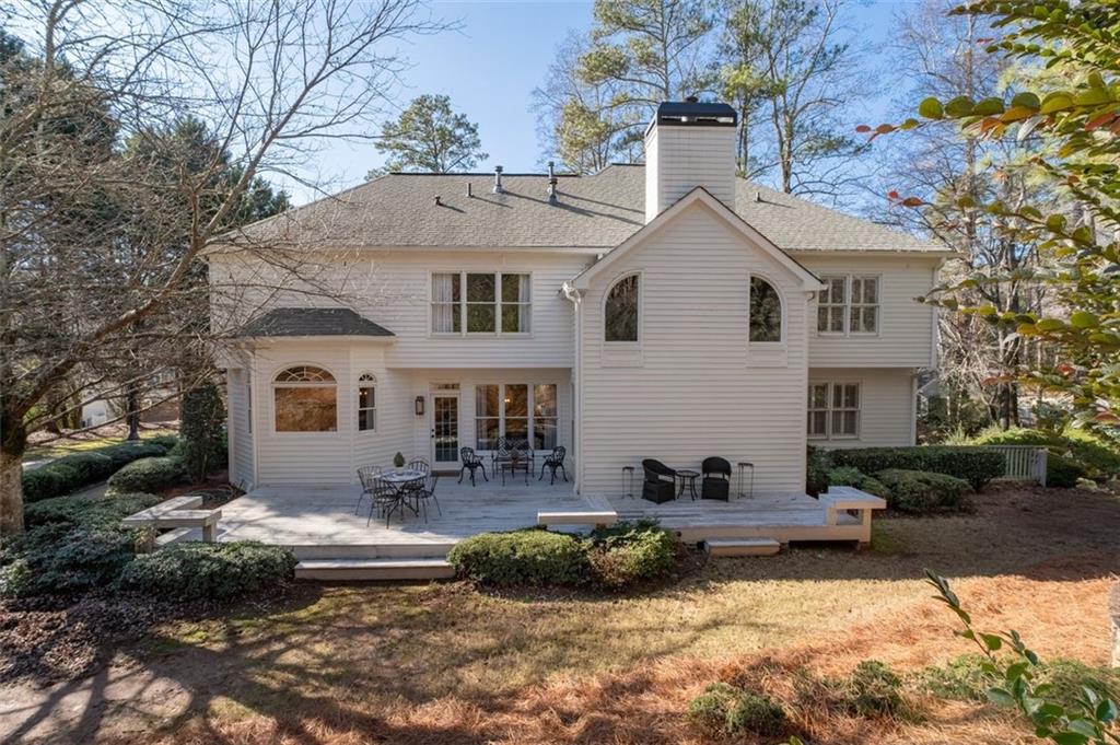 310 Glen Hampton Place Alpharetta, GA 30004 - Photo 38 of 61 a front view of a house with a yard