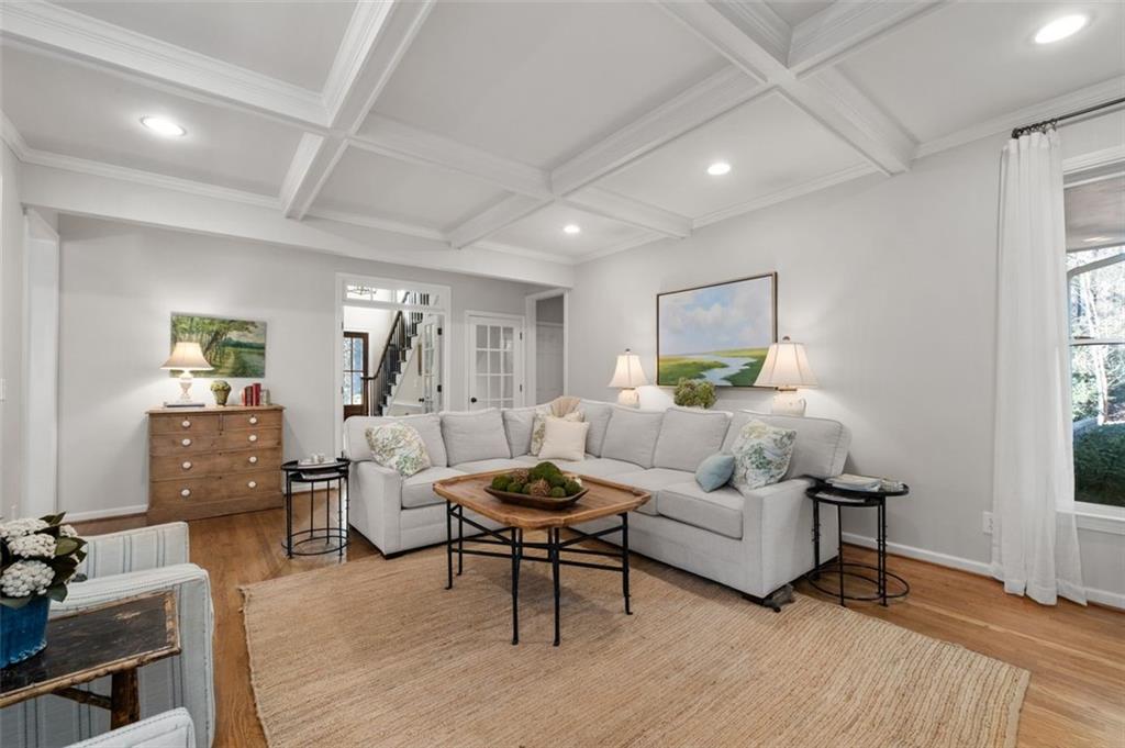 310 Glen Hampton Place Alpharetta, GA 30004 - Photo 46 of 61 a living room with furniture and a wooden floor
