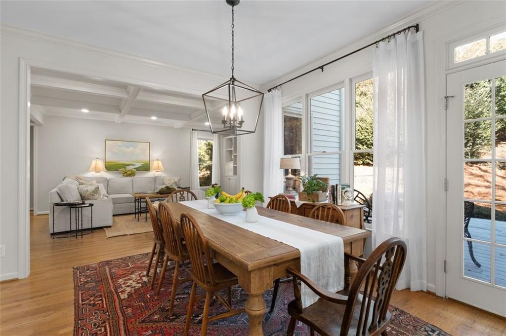 310 Glen Hampton Place Alpharetta, GA 30004 - Photo 49 of 61 a view of a dining room with furniture window and wooden floor