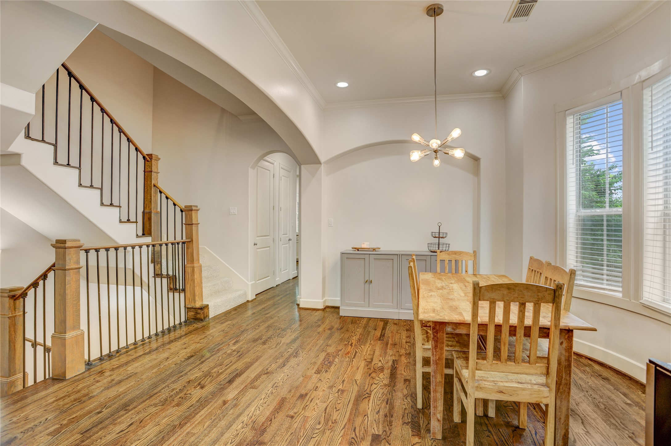 4262 Childress Street, Unit B Houston, TX 77005 - Photo 8 of 22 a view of a dining room with furniture window and wooden floor