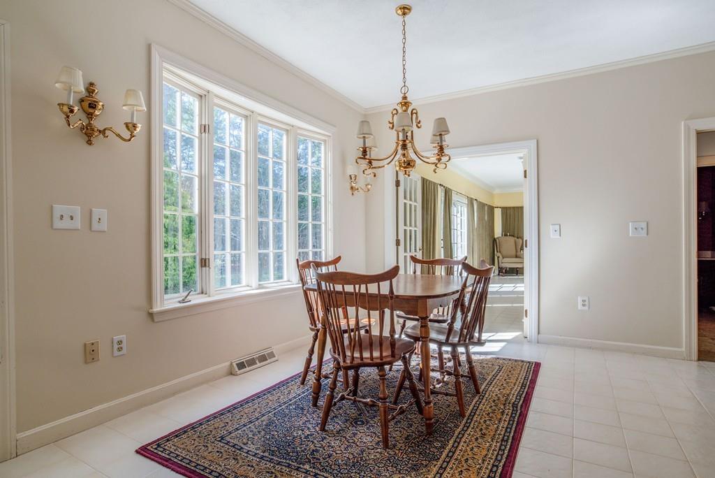 104 Fox Run Road Sudbury, MA 01776 - Photo 11 of 36 a view of a dining room with furniture window and outside view