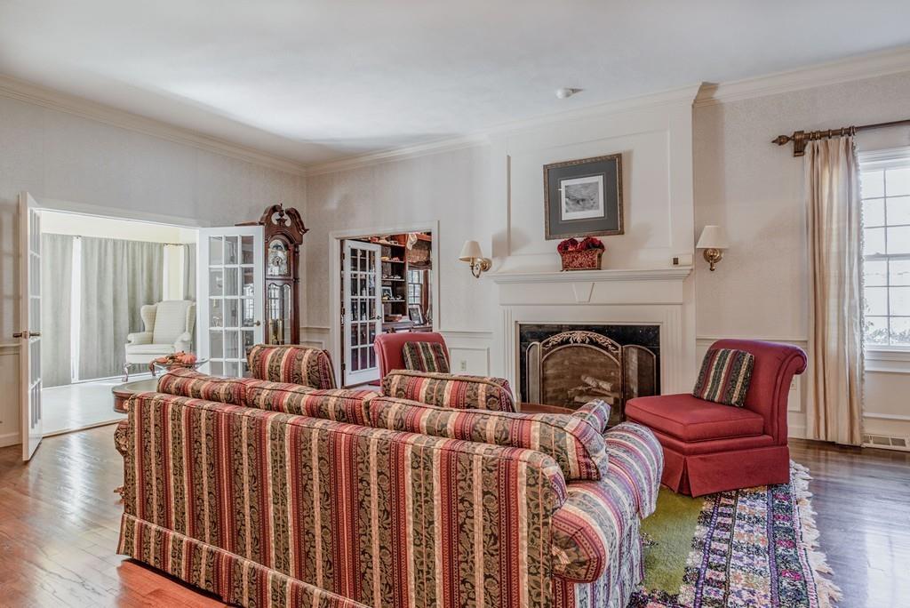 104 Fox Run Road Sudbury, MA 01776 - Photo 16 of 36 a living room with furniture a fireplace and a large window