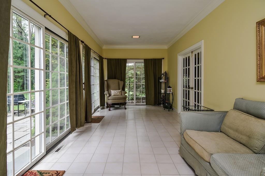 104 Fox Run Road Sudbury, MA 01776 - Photo 19 of 36 a living room with furniture and large windows
