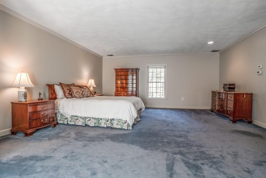 104 Fox Run Road Sudbury, MA 01776 - Photo 23 of 36 a spacious bedroom with a bed and a window