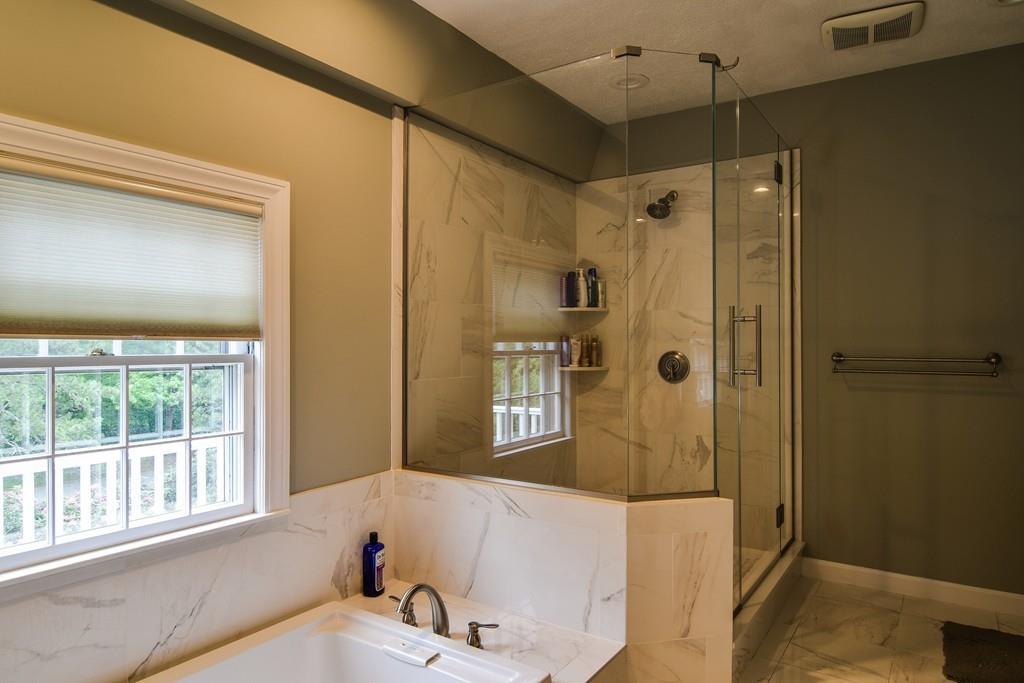 104 Fox Run Road Sudbury, MA 01776 - Photo 24 of 36 a bathroom with a tub and a shower