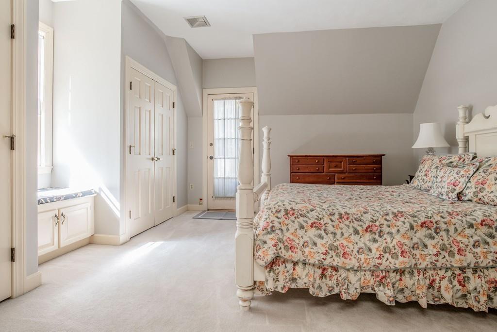 104 Fox Run Road Sudbury, MA 01776 - Photo 25 of 36 a bedroom with a bed and a couch