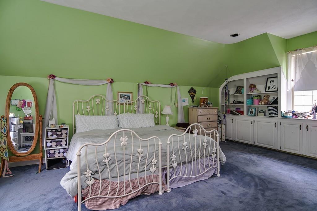 104 Fox Run Road Sudbury, MA 01776 - Photo 28 of 36 a bedroom with a bed next to a window with the outer view