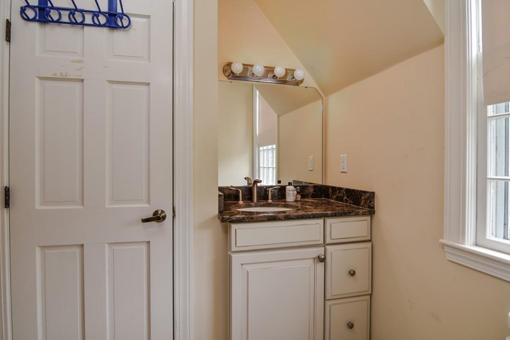 104 Fox Run Road Sudbury, MA 01776 - Photo 29 of 36 a bathroom with a granite countertop sink and a mirror