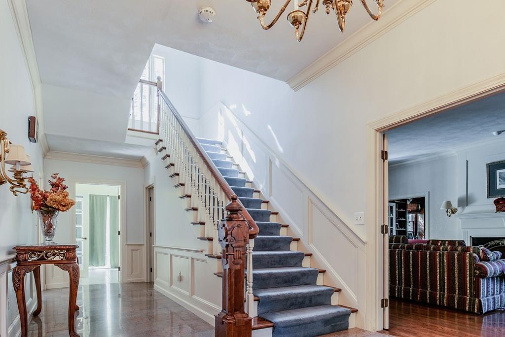 104 Fox Run Road Sudbury, MA 01776 - Photo 3 of 36 a view of entryway and hall with wooden floor