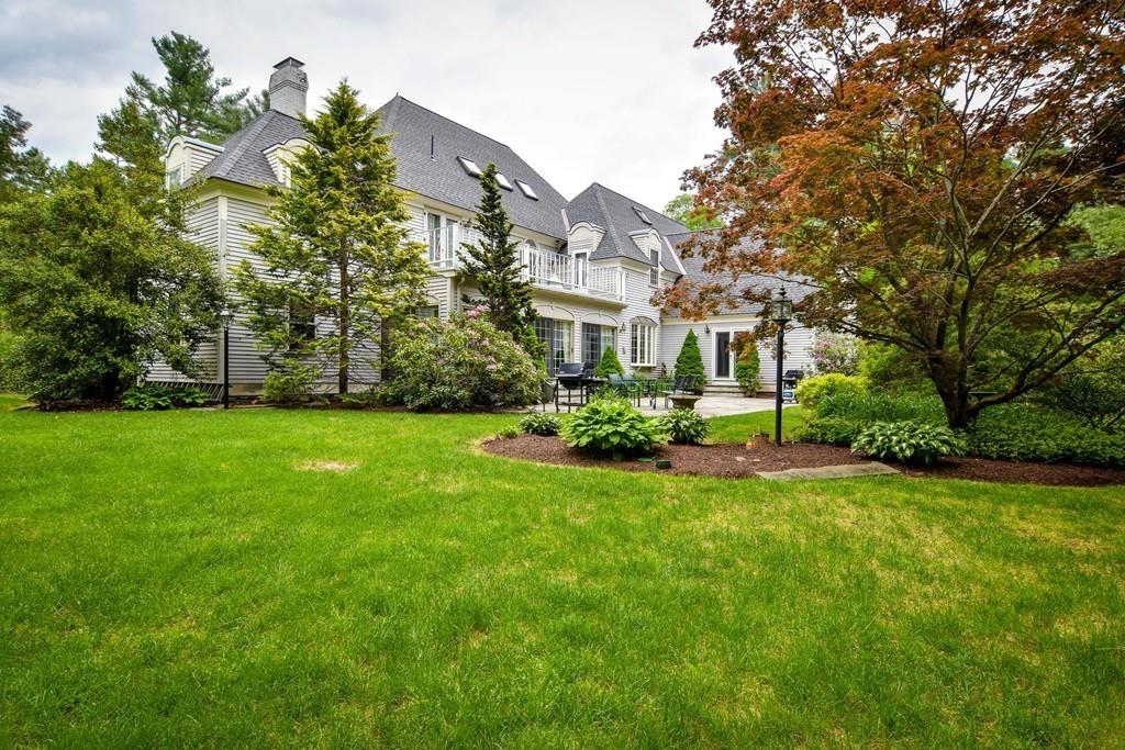 104 Fox Run Road Sudbury, MA 01776 - Photo 32 of 36 a front view of a house with a garden