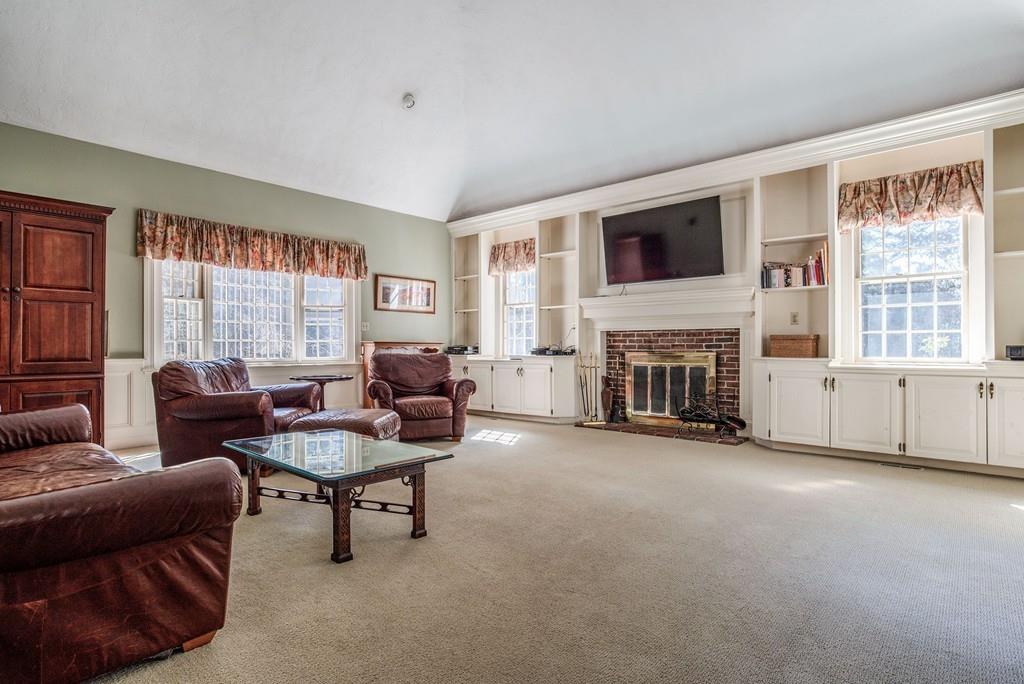 104 Fox Run Road Sudbury, MA 01776 - Photo 4 of 36 a living room with furniture and a fireplace