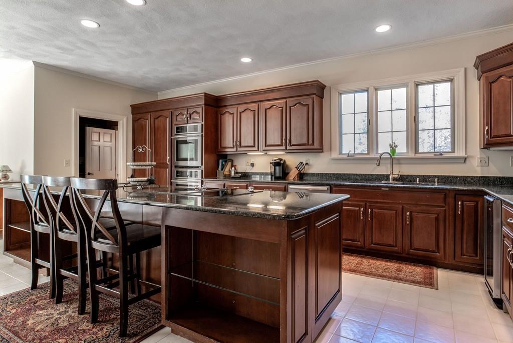 104 Fox Run Road Sudbury, MA 01776 - Photo 8 of 36 a kitchen with granite countertop a sink and cabinets