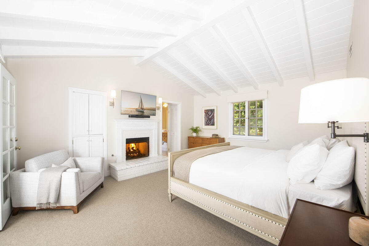 223 Rametto Road Santa Barbara, CA 93108 - Photo 23 of 35 a bedroom with a bed and a fireplace