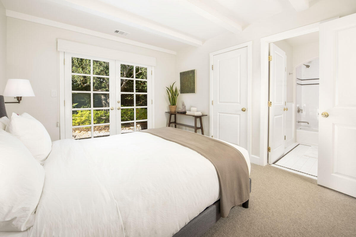 223 Rametto Road Santa Barbara, CA 93108 - Photo 25 of 35 a bedroom with a bed and a large window