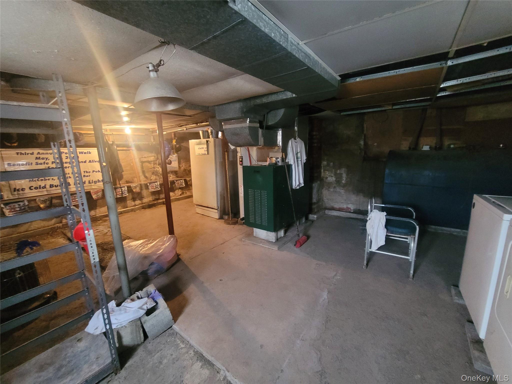 31 South Liberty Road Liberty, NY 12754 - Photo 7 of 8 Unfinished below grade area featuring heating fuel, washer / dryer, heating unit, and water heater