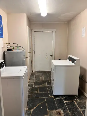 a bathroom with a black and white checkered floor