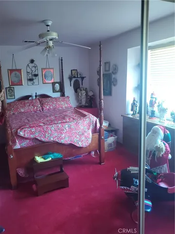 a bed room with a bed and a table