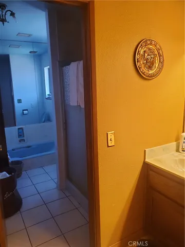 a view of a bathroom with a sink and a mirror
