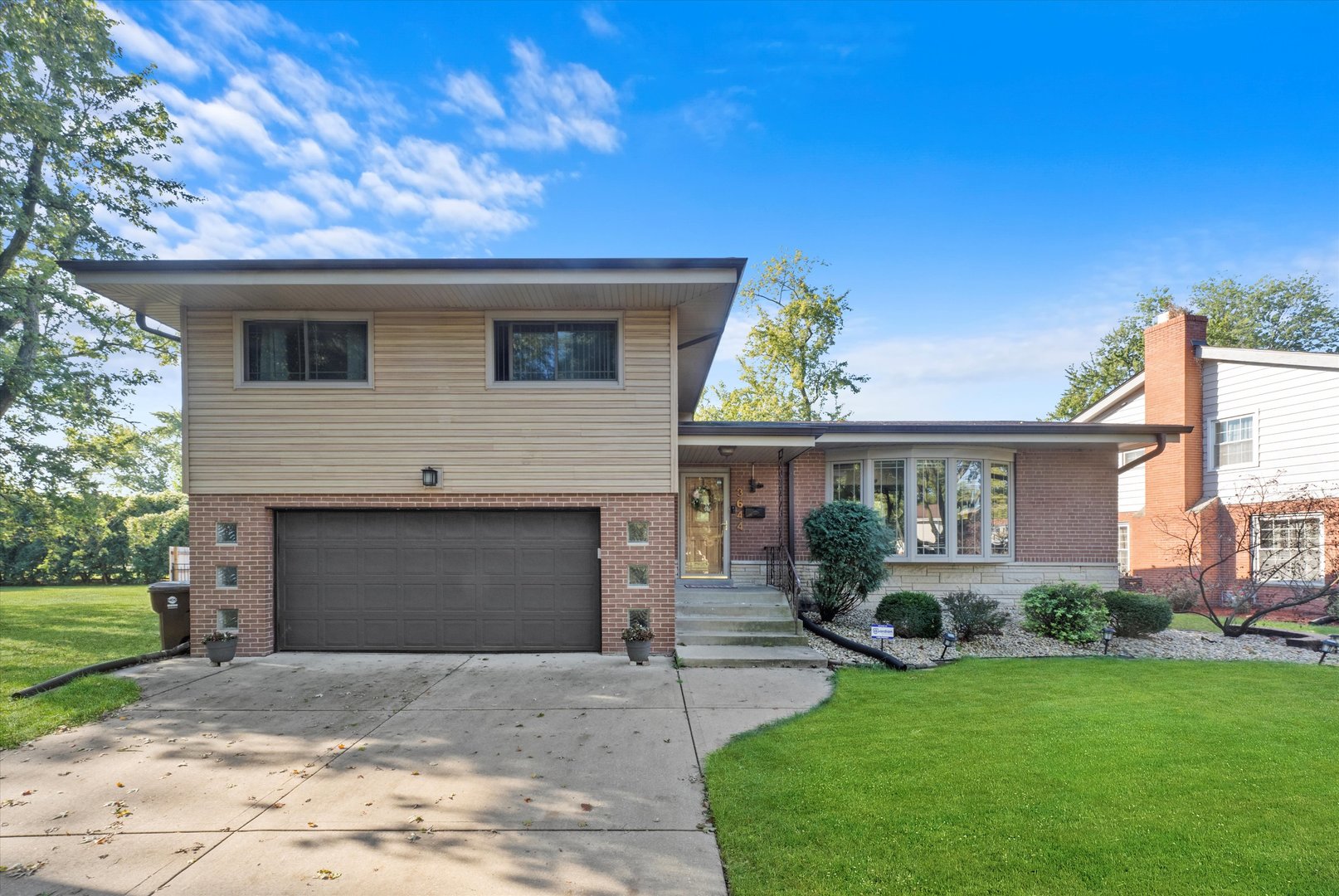 3644 Poplar Road Flossmoor, IL 60422 - Photo 1 of 22 a front view of a house with a yard and a garage