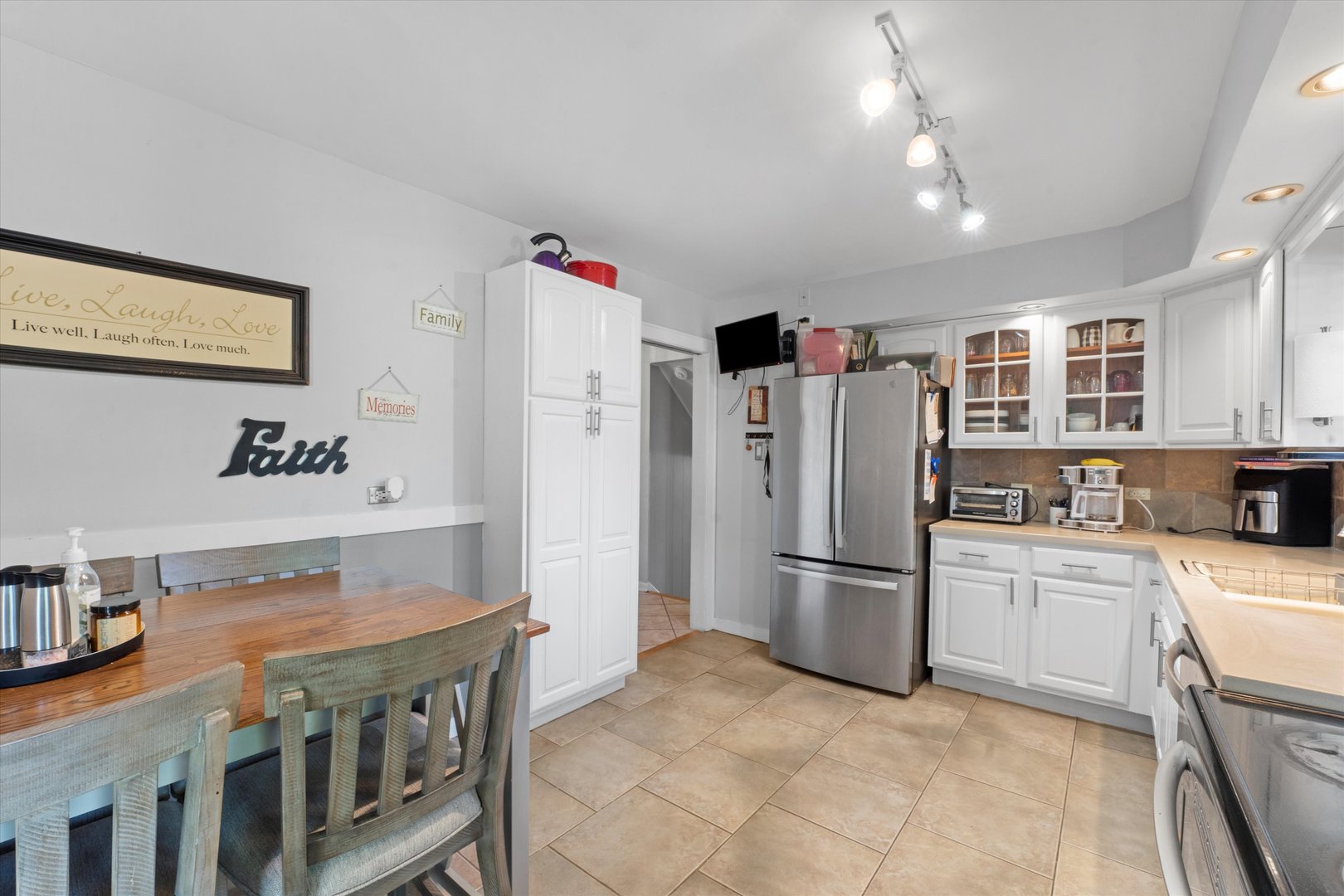3644 Poplar Road Flossmoor, IL 60422 - Photo 8 of 22 a kitchen with stainless steel appliances granite countertop a refrigerator a stove a sink dishwasher and a refrigerator with wooden floor