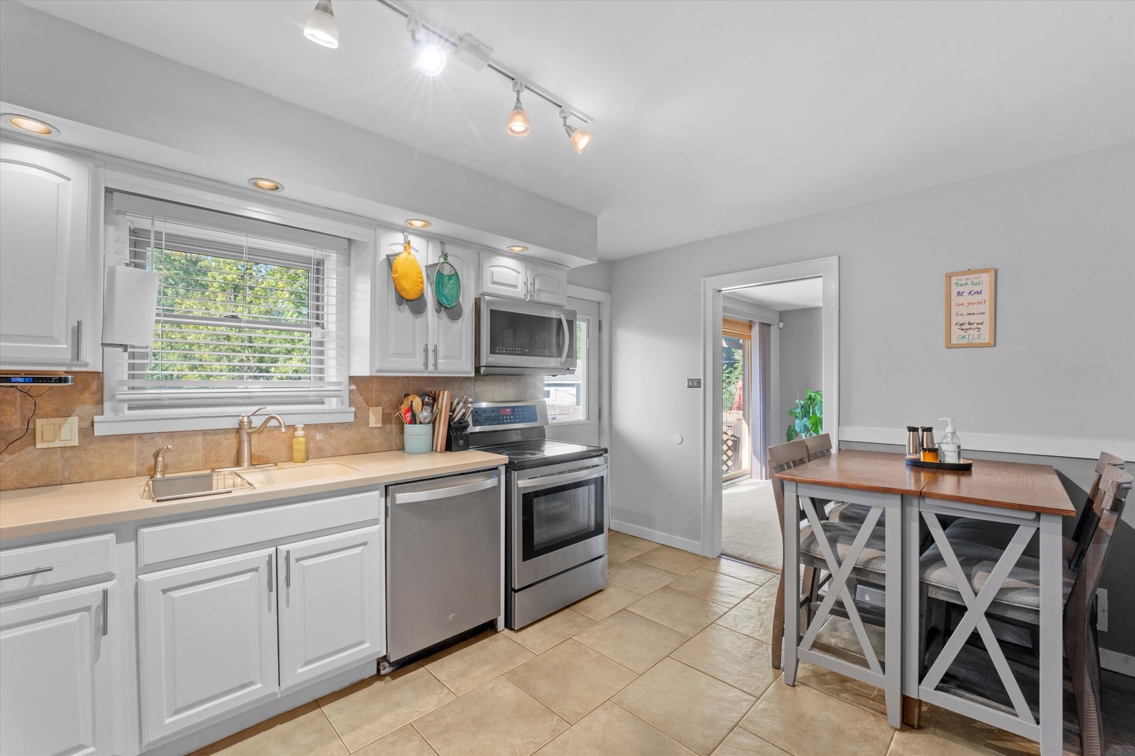 3644 Poplar Road Flossmoor, IL 60422 - Photo 10 of 22 a kitchen with a table chairs sink and cabinets