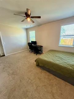 a bathroom with double vanity sinks and a mirror