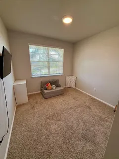 a view of livingroom with furniture and window