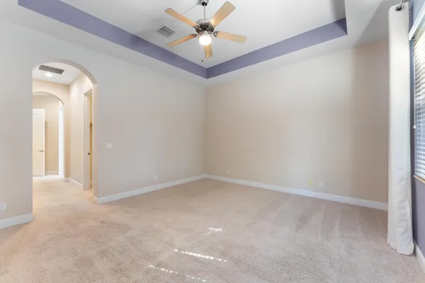 wooden floor in a hall with a window