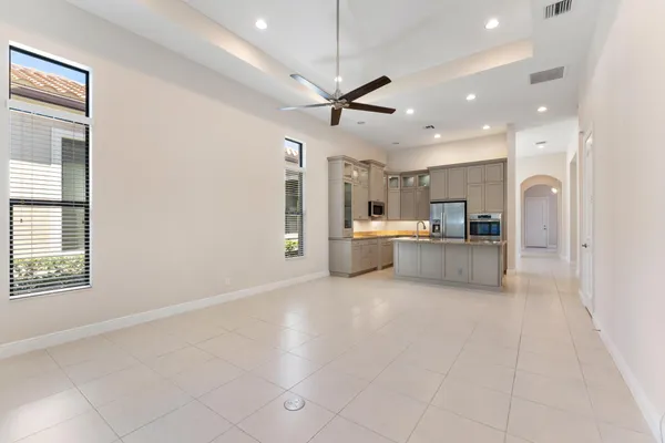 a view of a kitchen with a sink and microwave