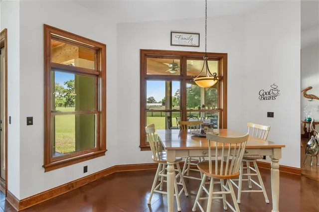 a view of a livingroom with furniture and a window