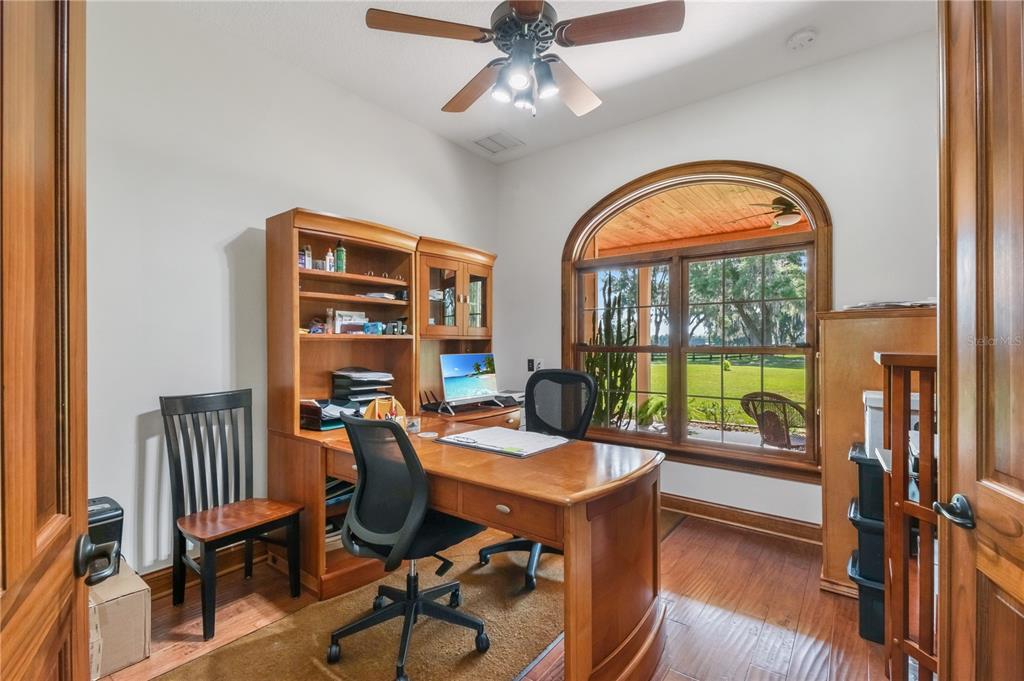6140 Northwest 145th Avenue Road Morriston, FL 32668 - Photo 25 of 63 a view of a livingroom with furniture and a floor to ceiling window