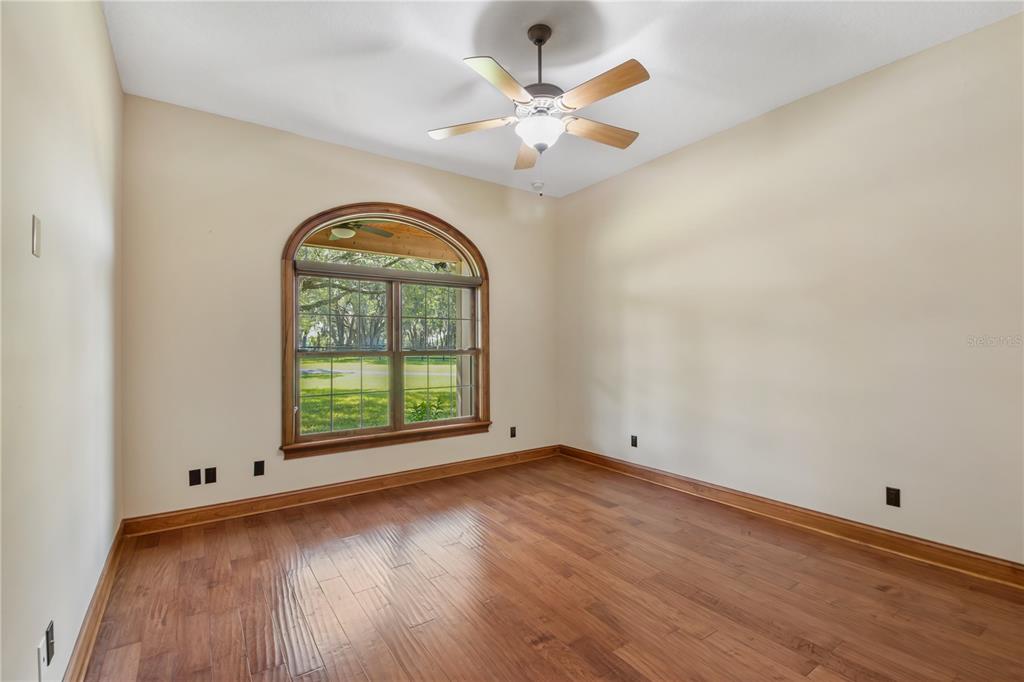 6140 Northwest 145th Avenue Road Morriston, FL 32668 - Photo 29 of 63 an empty room with wooden floor fan and windows