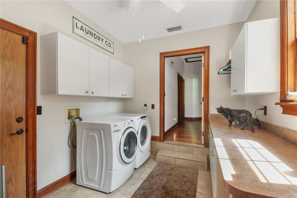 6140 Northwest 145th Avenue Road Morriston, FL 32668 - Photo 31 of 63 a view of a hallway with washer and dryer