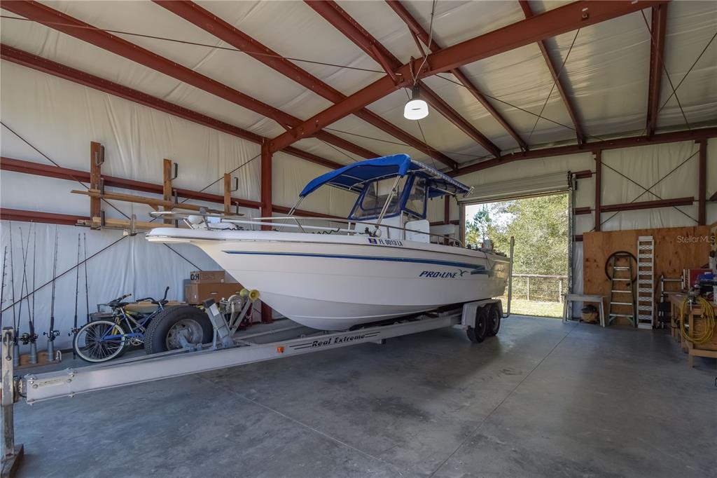 6140 Northwest 145th Avenue Road Morriston, FL 32668 - Photo 42 of 63 a view of a room with gym equipment