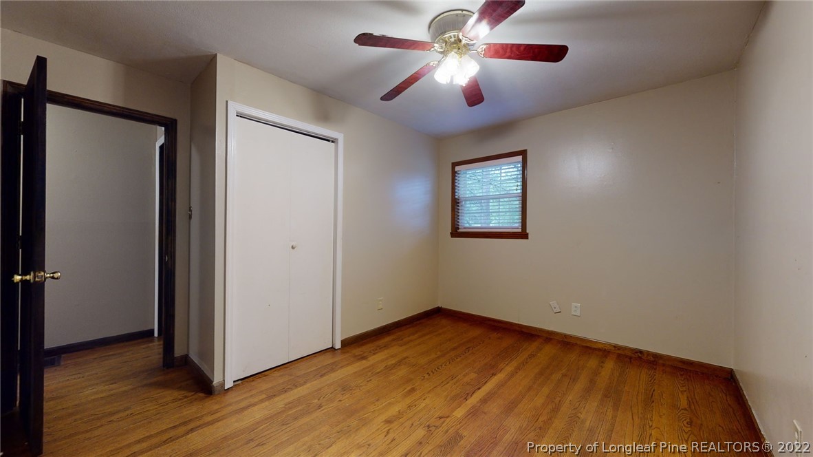 4311 Coventry Road Fayetteville, NC 28304 - Photo 14 of 22 a view of empty room with wooden floor