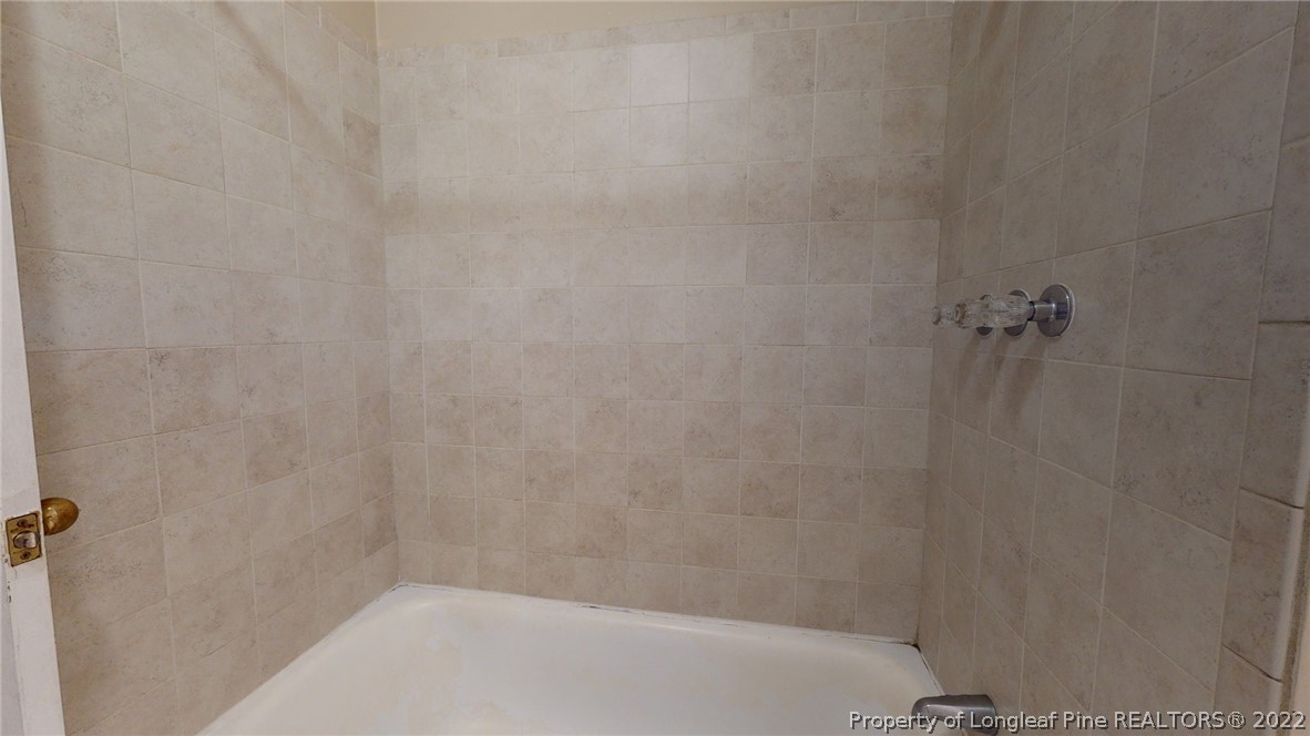 4311 Coventry Road Fayetteville, NC 28304 - Photo 15 of 22 a bathroom with a shower
