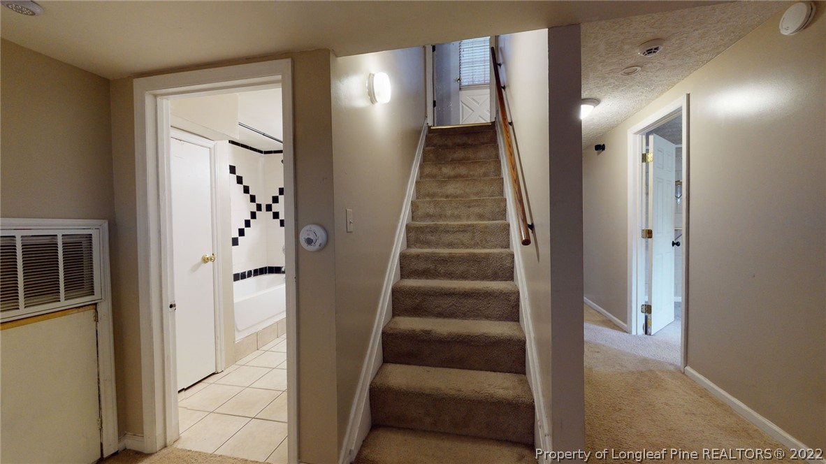 4311 Coventry Road Fayetteville, NC 28304 - Photo 20 of 22 a view of entryway with furniture and wooden floor
