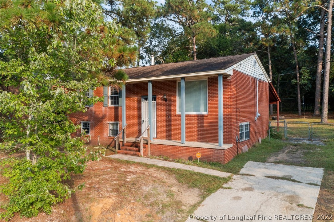 4311 Coventry Road Fayetteville, NC 28304 - Photo 2 of 22 a front view of a house with garden