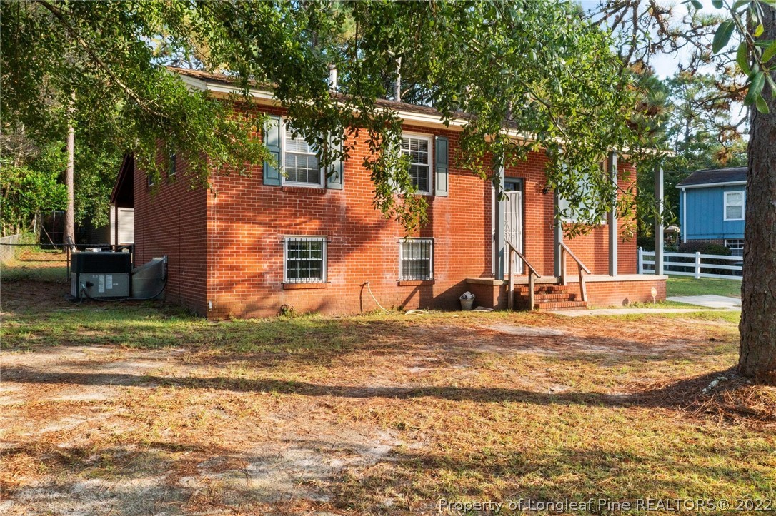 4311 Coventry Road Fayetteville, NC 28304 - Photo 3 of 22 a view of a house with backyard and sitting area