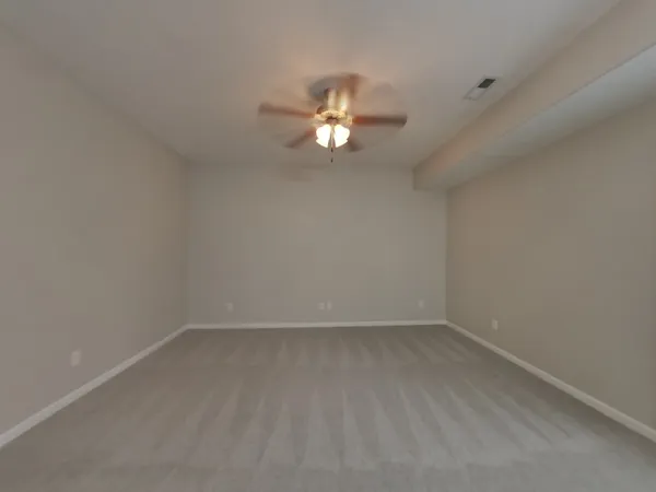 a kitchen with a refrigerator and a stove