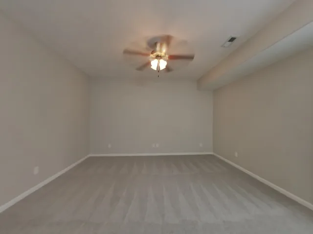 a kitchen with a refrigerator and a stove