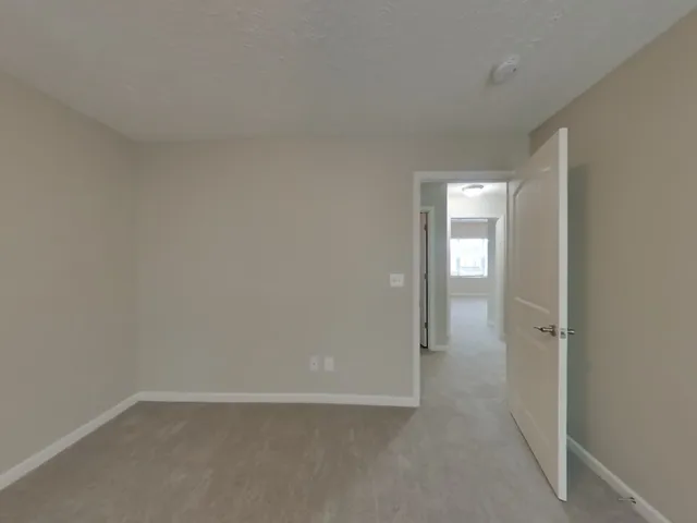 a bathroom with a toilet and a bath tub