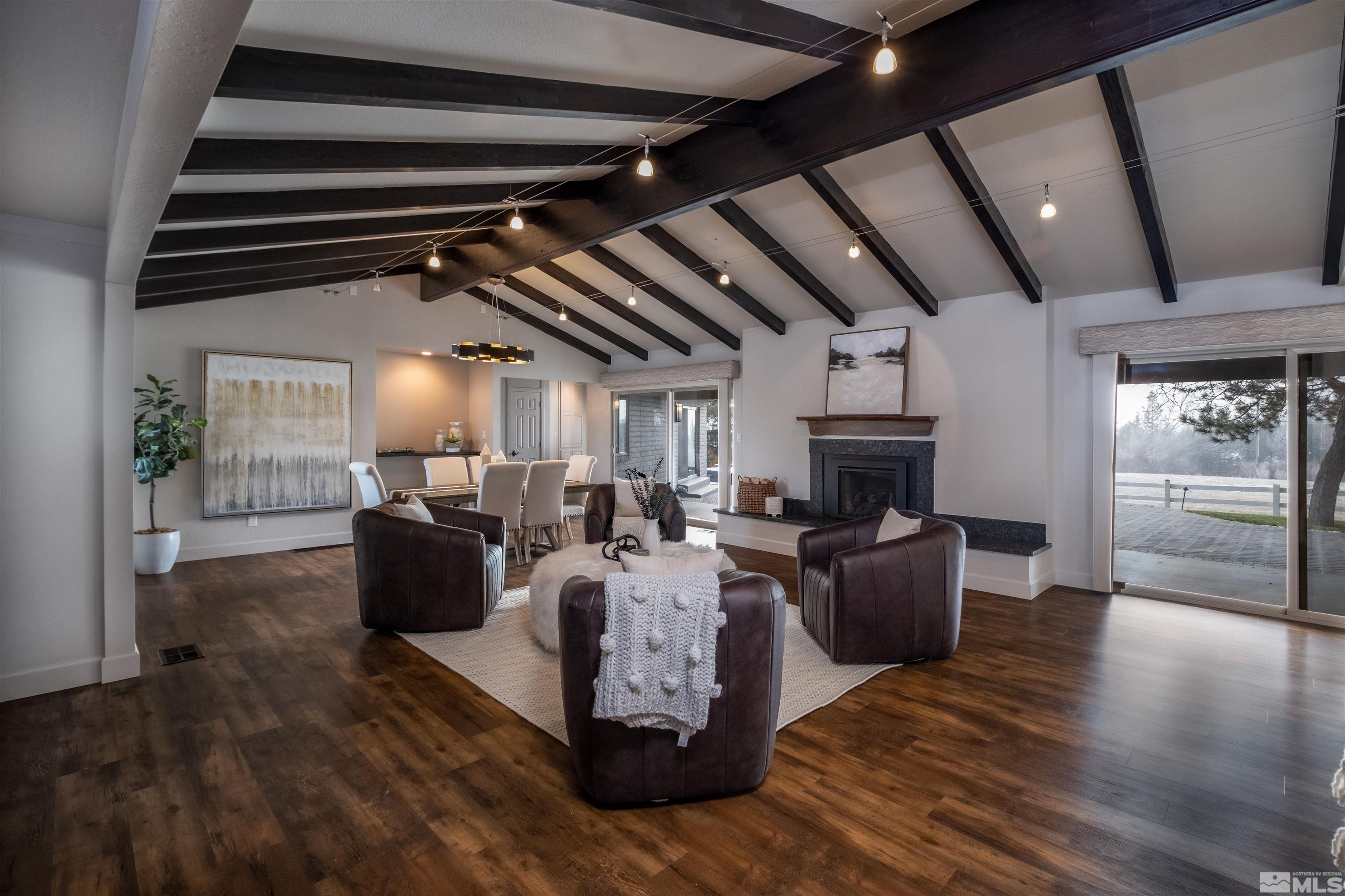 1940 View Reno, NV 89511 - Photo 7 of 38 a living room with fireplace furniture and a wooden floor
