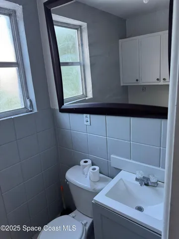 a bathroom with a sink and a toilet