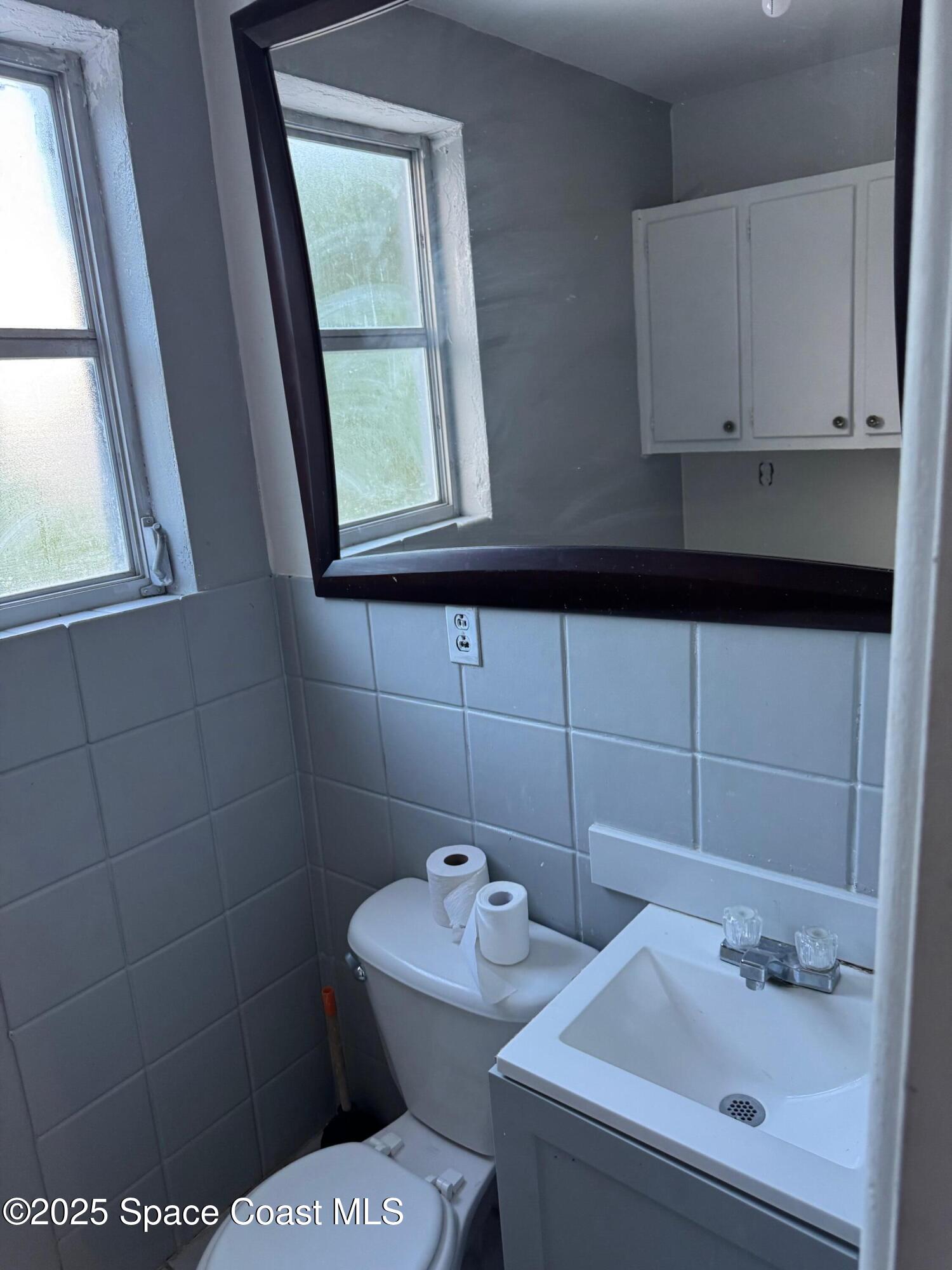 808 Forrest Avenue Cocoa, FL 32922 - Photo 11 of 11 a bathroom with a sink and a toilet