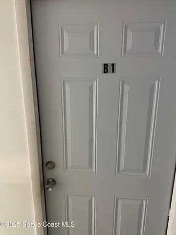 a view of a hallway with refrigerator