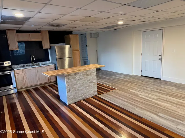 a kitchen with lots of counter top space and appliances