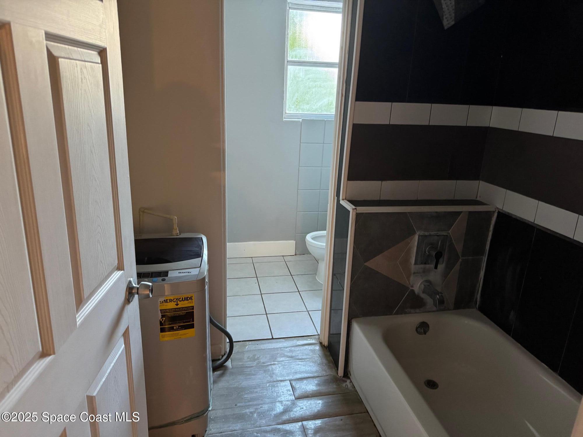 808 Forrest Avenue Cocoa, FL 32922 - Photo 10 of 11 a bathroom with a bathtub sink and toilet
