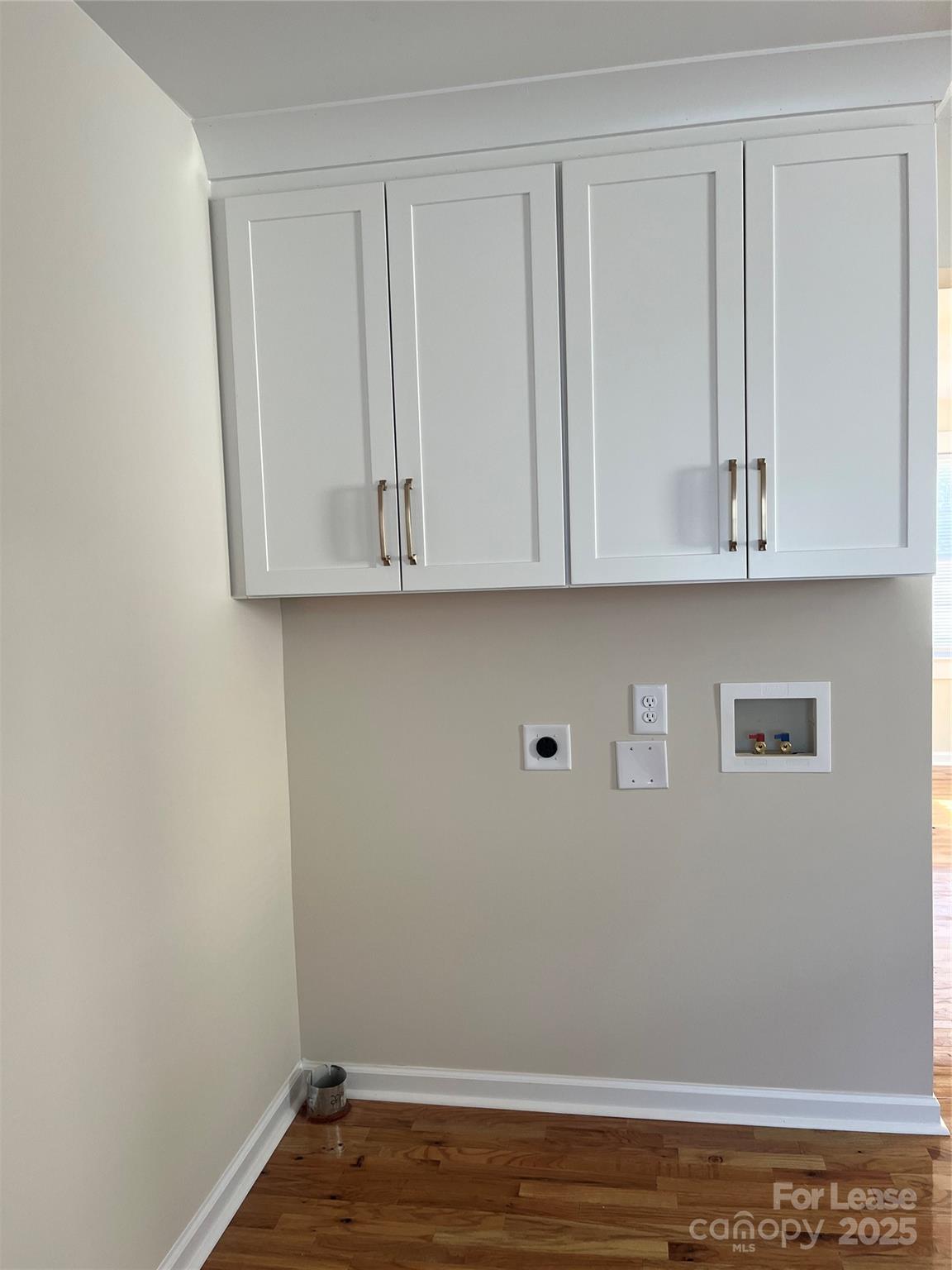 60 3rd Street Concord, NC 28025 - Photo 5 of 10 a view of cabinets and wooden floor