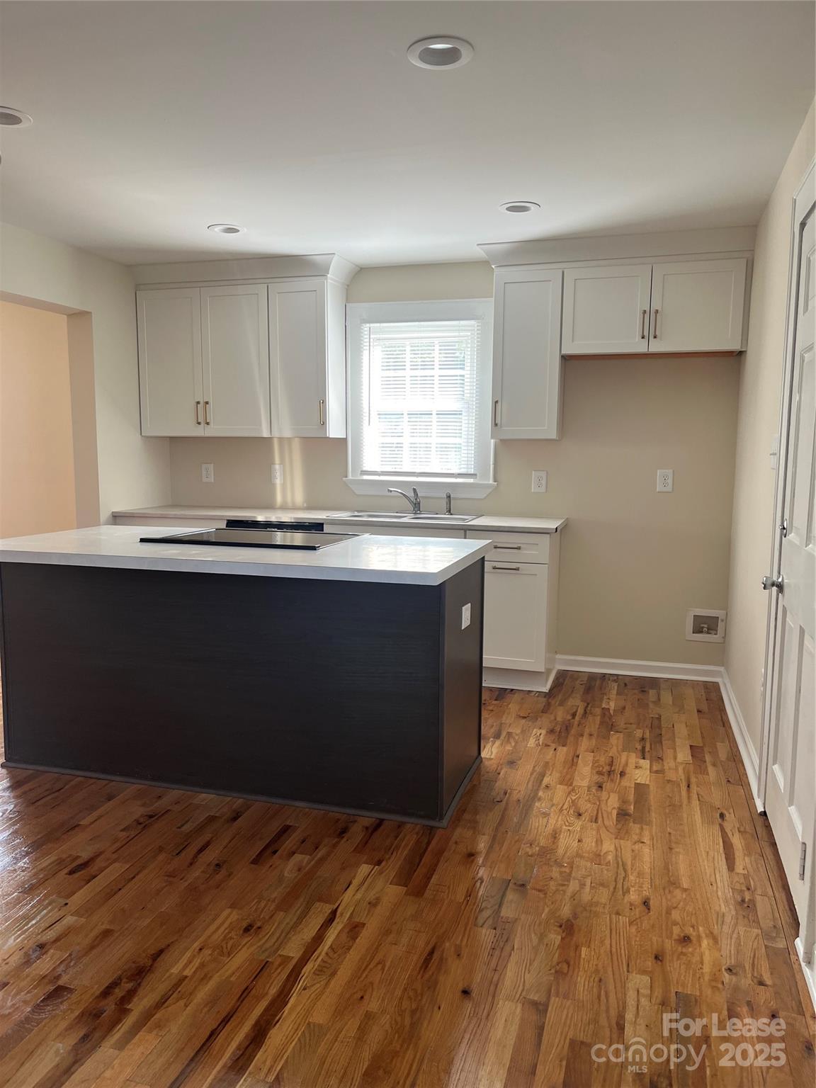 60 3rd Street Concord, NC 28025 - Photo 8 of 10 a kitchen with a sink and cabinets